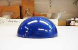Photo showing a side view of the finished large cabochon which is 3 inches across and an inch and a half tall.