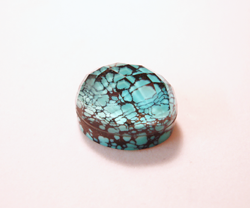 Photo showing the Aquamarine glued onto the spiderweb Turquoise