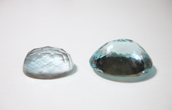 Photo of an Aquamarined before re-cutting it and the other one that is finished.