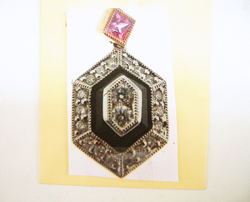 Photo of an Onyx and diamond pendant.