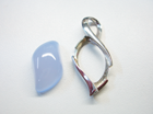 A curvy fat marquise shaped blue Chalcedony cabochon.
