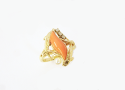 A ladies ring with a marquise shaped pink Coral mounted in the ring.