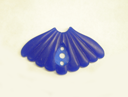 Photo of a blue wax carved in the shape they want me to carve a mother of pearl carving.