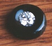 Round onyx with Diamond set in the center.