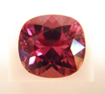 Picture of an emerald cut Radiant cut pink Sapphire.