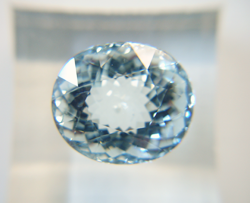 A light blue oval Aquamarine with a Window.