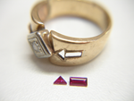A ring with tiny Rubies which are chipped.