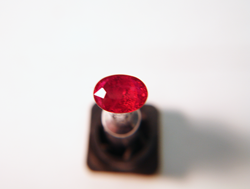 An oval Ruby ready to be faceted.