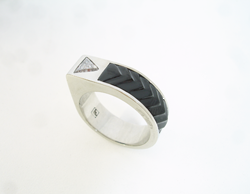 Teh finished ring with a trillion diamond and the carved Black Jade inlay.