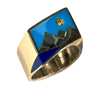Small photo of a ring with a mountain scene inlaid with Lapis and Turquoise and a yellow Sapphire for the sun.