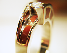 A blue cabochon in a ring. The cabochon is very scratched.