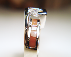 Ring showing a Jasper inlay under the marquise diamond.