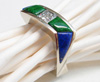 Photo of a white gold ring with blue Lapis and green Maw Sit Sit Jade inlays.
