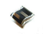Photo of white gold cufflinks inlaid with faceted Black Onyx.
