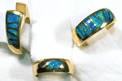 3 rings inlaid with numerous Opal inlays.