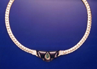 Small photo of a necklace with Black Jade and a green Emerald in the middle.
