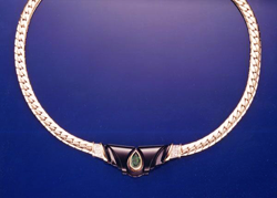 Necklace with carved Black Jade and a pear shaped Emerald in the middle.