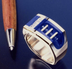 Ring with Lapis with a channel of baguette diamonds which are held in place by bezels of Lapis.