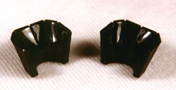 The piece has been divided in 2 and grooves are carved into it.