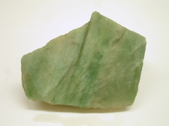Picture of a rough green rock called aventurine.