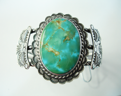 Turquoise cabochon which has been repaired.