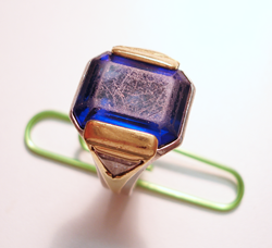 An emerald cut Tanzanite mounted in a ring.
