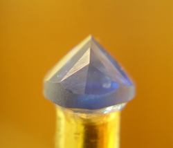 Many more facets on the stone now and the chip is almsot gone.
