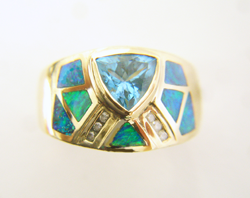 Photo of the finished ring with new Opal inlays which match.
