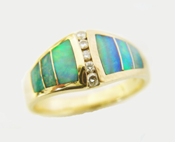 Photo of the finished ring with 3 new Opal inlays wich match the other 3 inlays in the ring.