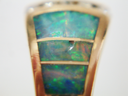 Photo of an Opal inlay wiht scratches and a chip