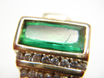 Picture of a green Tourmaline with a scratched table which needs the table repolished.