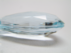 Side view of the Aquamarine drop with the groove carved in the edge.