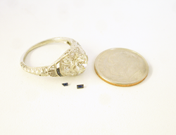 The 2 finished tiny Sapphires next to the ring they will be mounted into.