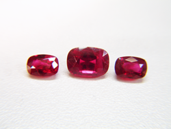 Shows all 3 cushion Rubies