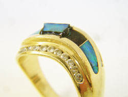 Shows where I have glued in a new Opal inlay with black Epoxy.