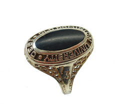 A ladies class ring with a black Onyx cabochon which is very scratched and dull.
