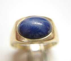 Picture of a Linde Star Sapphire which is in a ring and needs to be repolished.